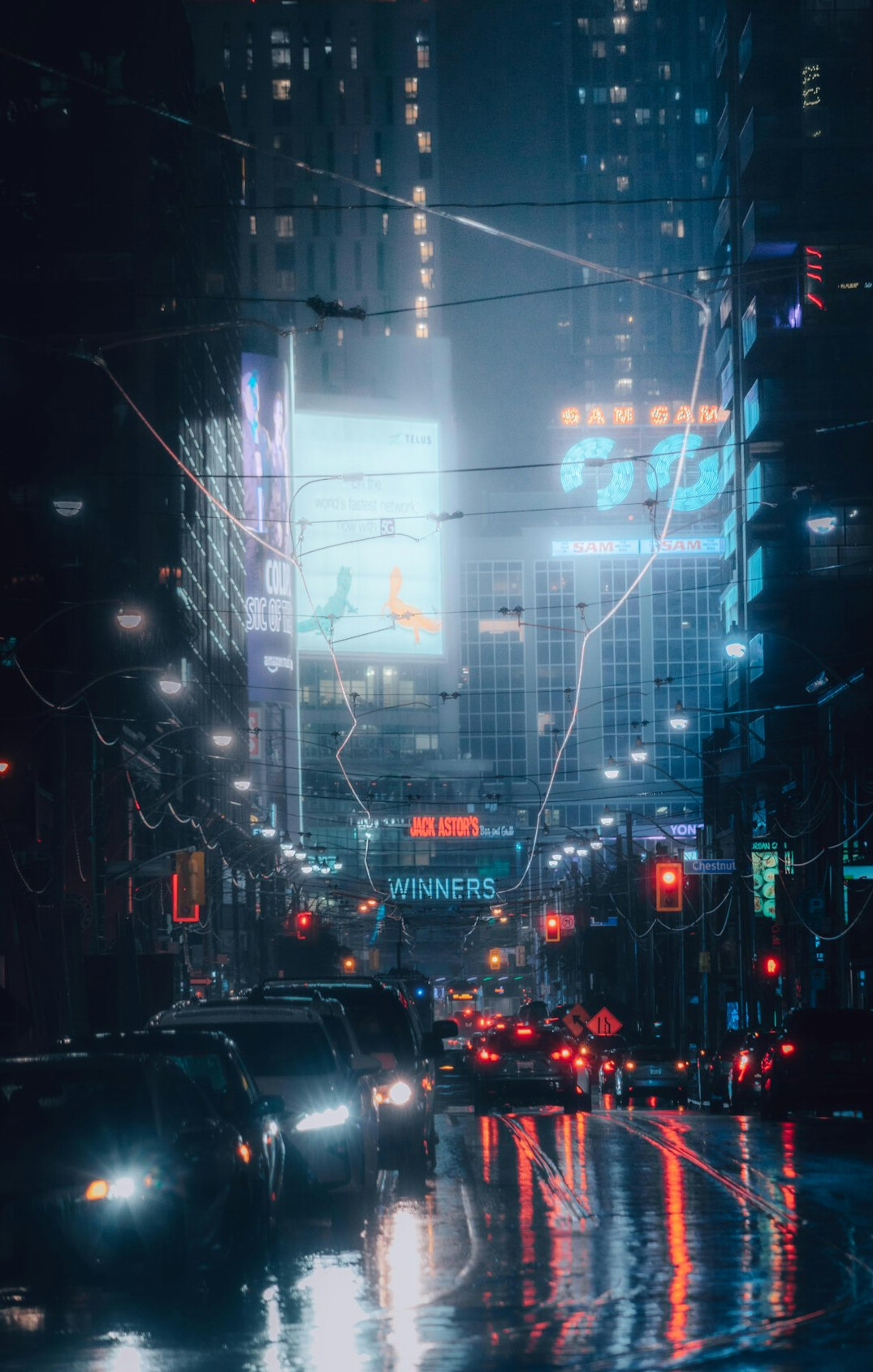 rainy city street at night